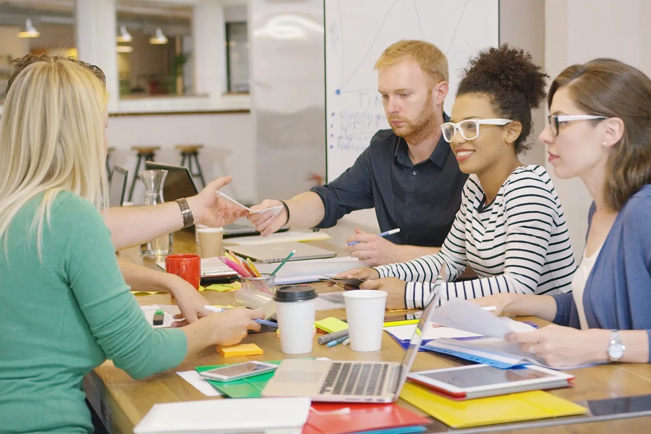 Teachers working together around a staffroom table