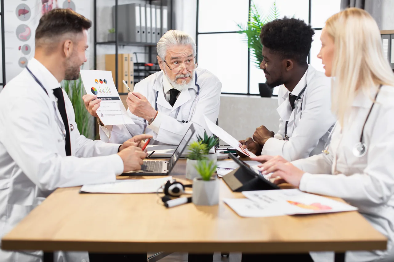 Pharmaceutical professionals meeting around a conference table