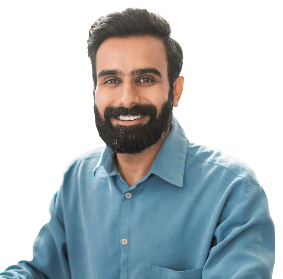 A smiling bearded engineer in a blue shirt