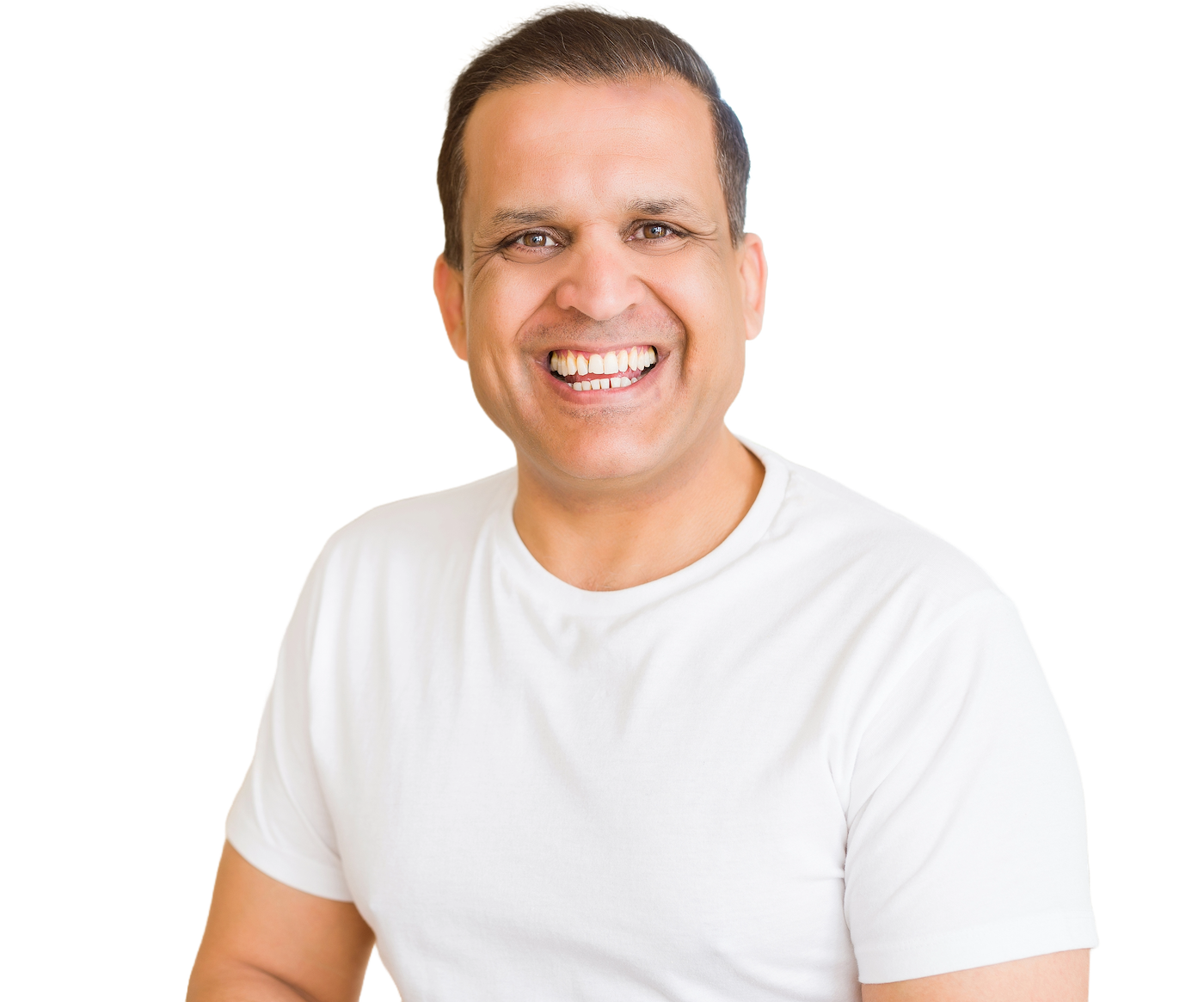 A smiling engineer with short dark hair in a plain white T-shirt