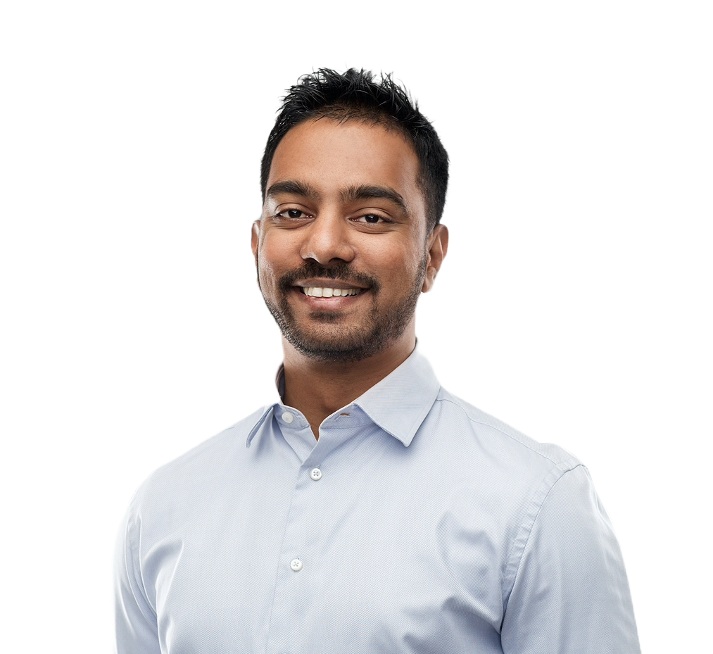 A smiling engineer in a light blue collared shirt