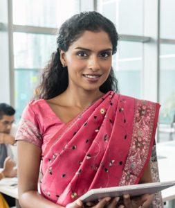 Confident Indian business woman looking at camera while holding